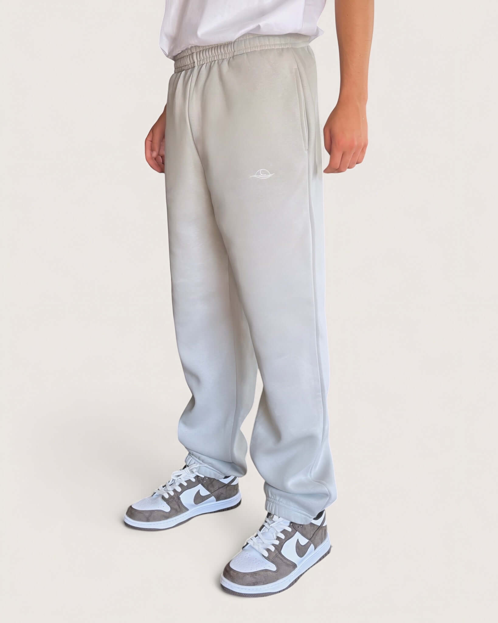Heavy Essential Sweatpants | Light Grey worn by model, showcasing loose fit and casual style.