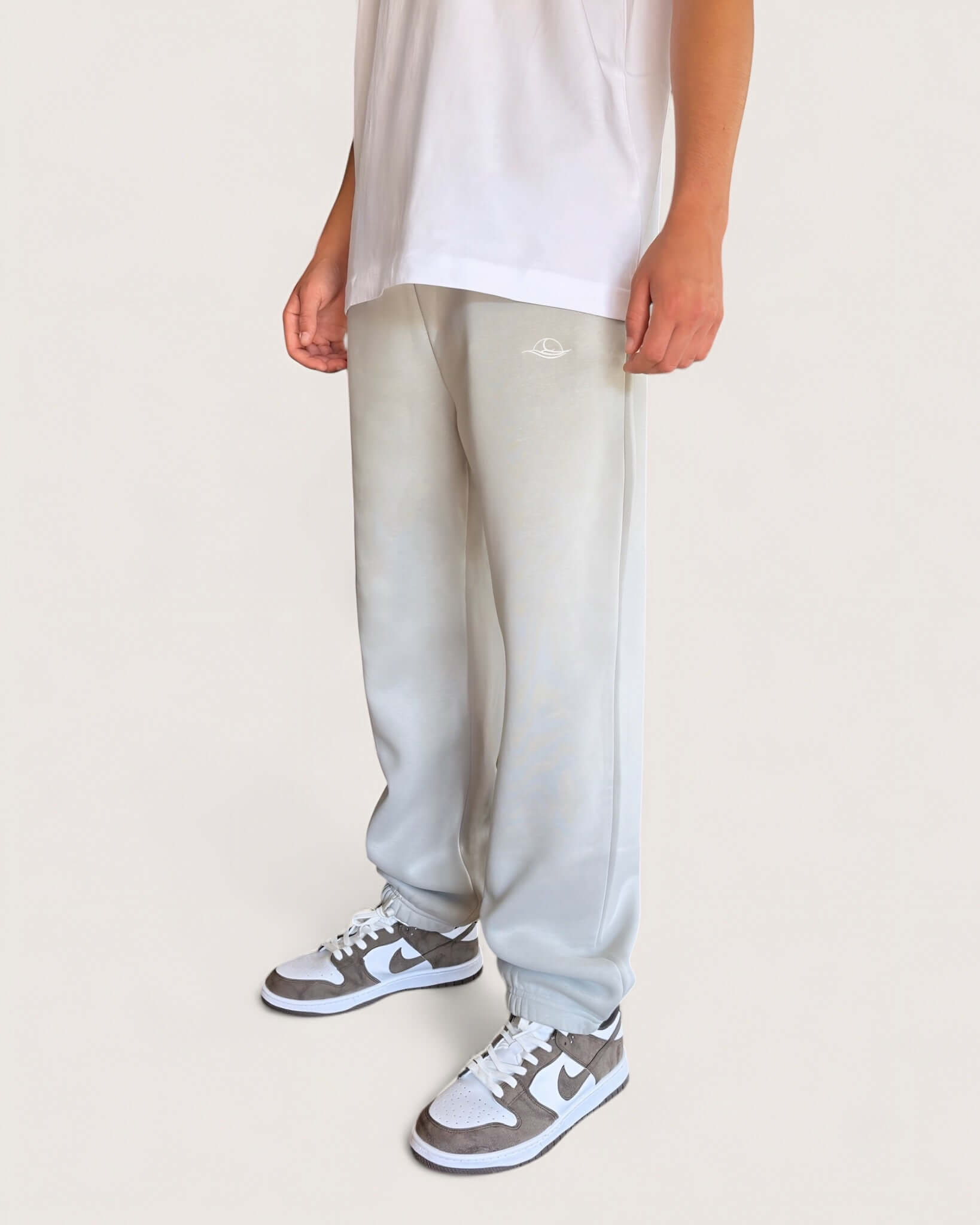 Heavy Essential Sweatpants | Light Grey worn by a model, showcasing the comfortable loose fit and soft fabric.