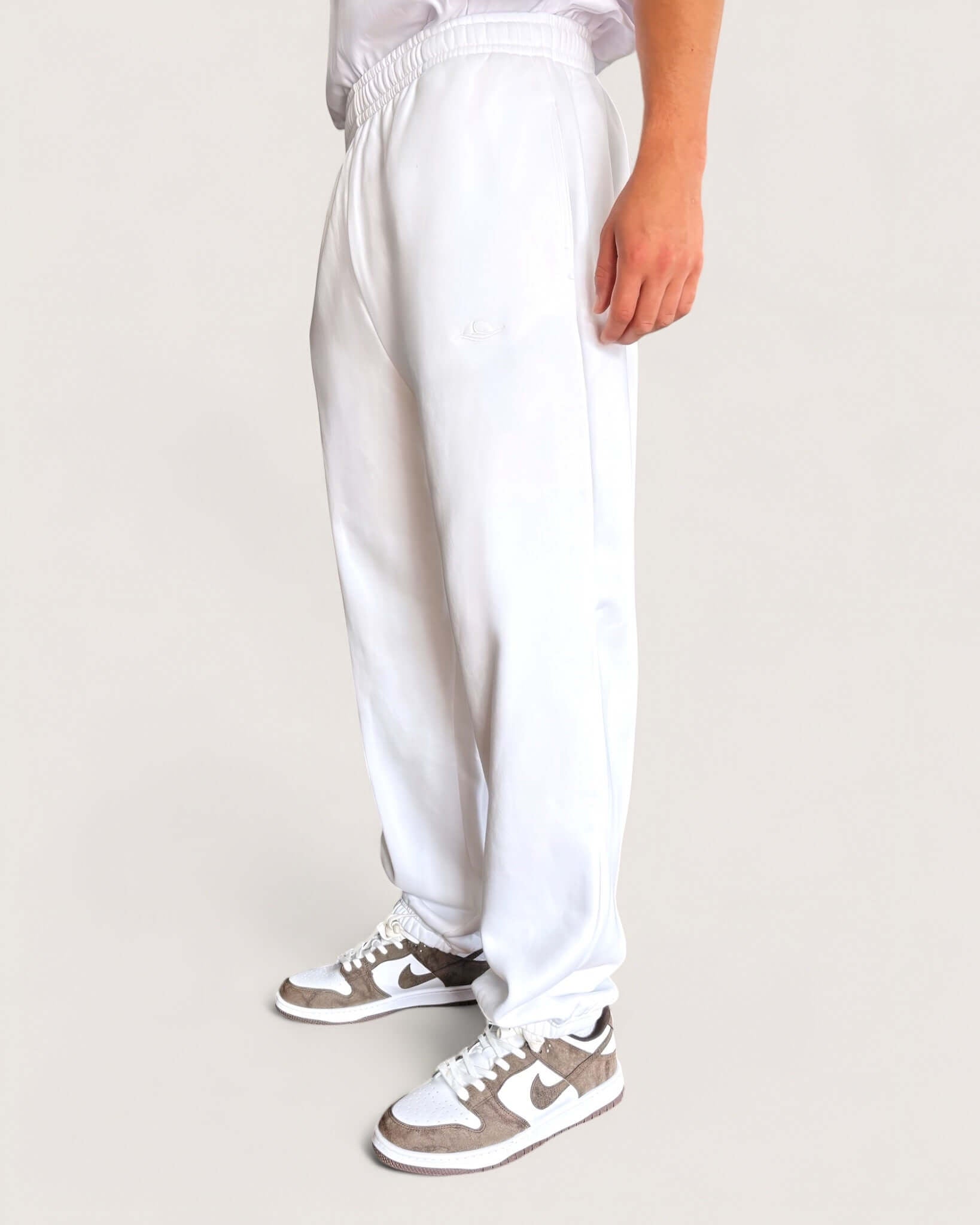 Heavy Essential Sweatpants | White in loose fit with embroidered logo and comfortable design.