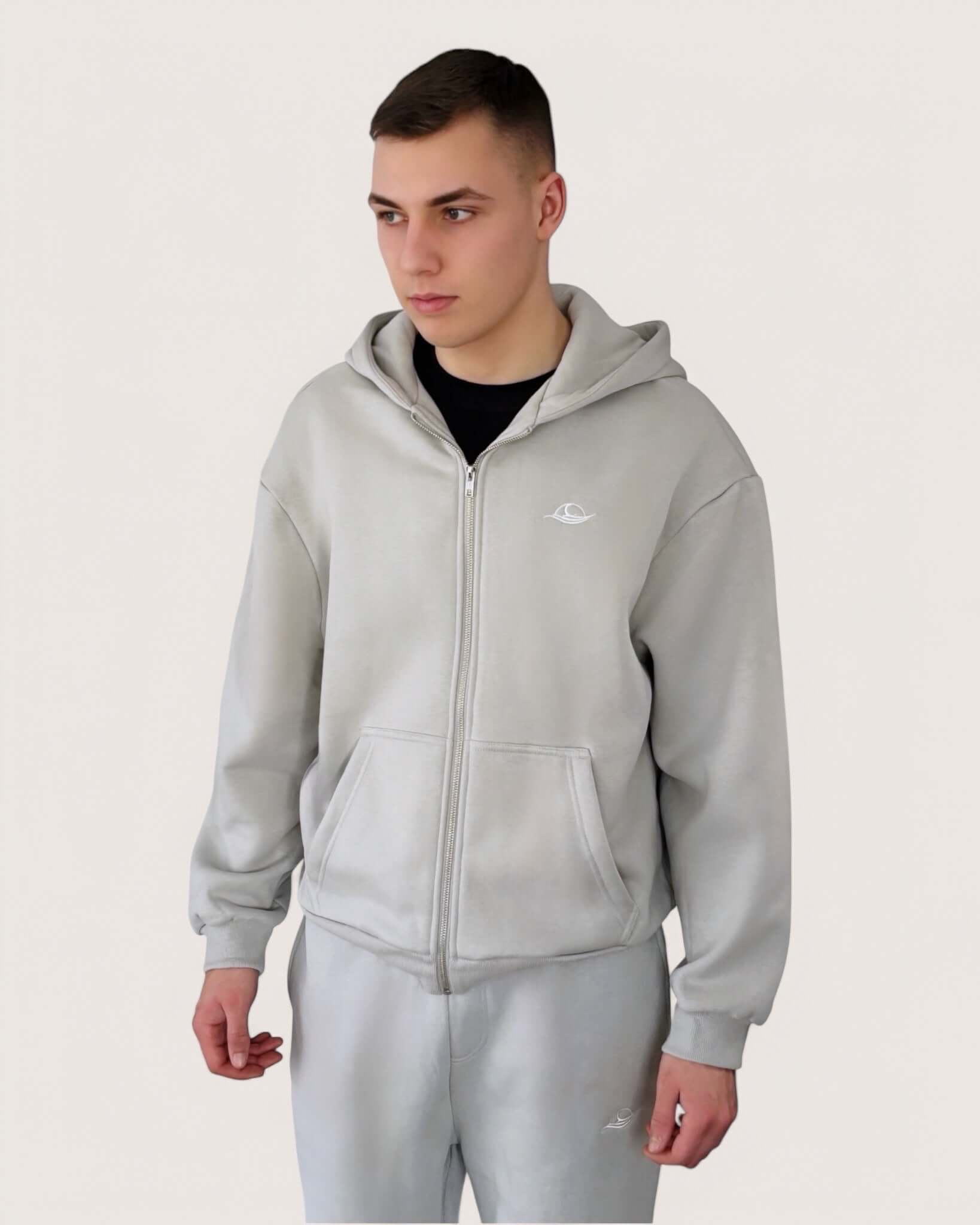 Heavy Essential Zip Hoodie | Light Grey worn by a model, showcasing an oversized fit and metal zipper.